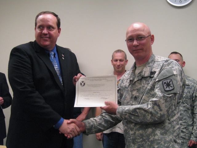 Michael inducting a Soldier/Student into the SALUTE Honor Society.